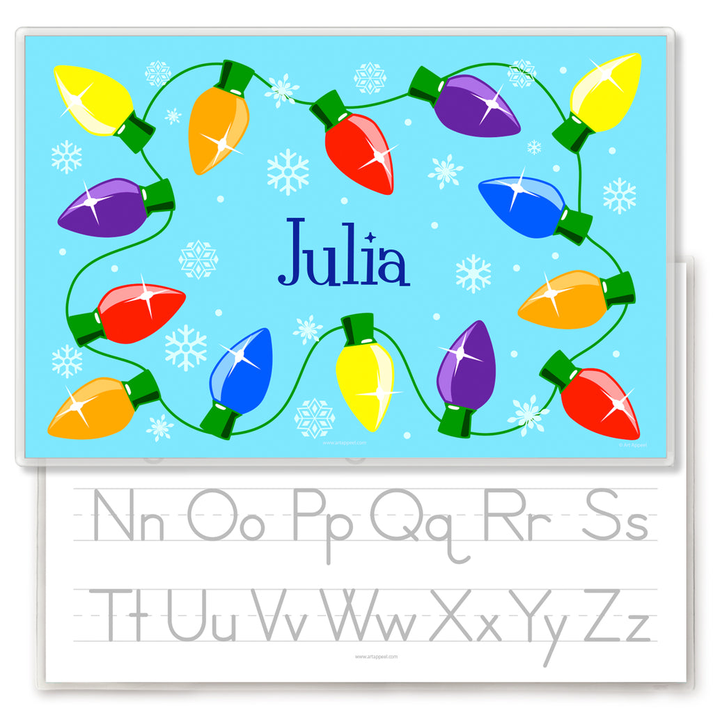 Christmas Lights Personalized Kids Placemat with a string of colorful Christmas lights on a light blue background with snowflakes.  Child's name is in the center in dark blue. Placemat back has alphabet letters for tracing.
