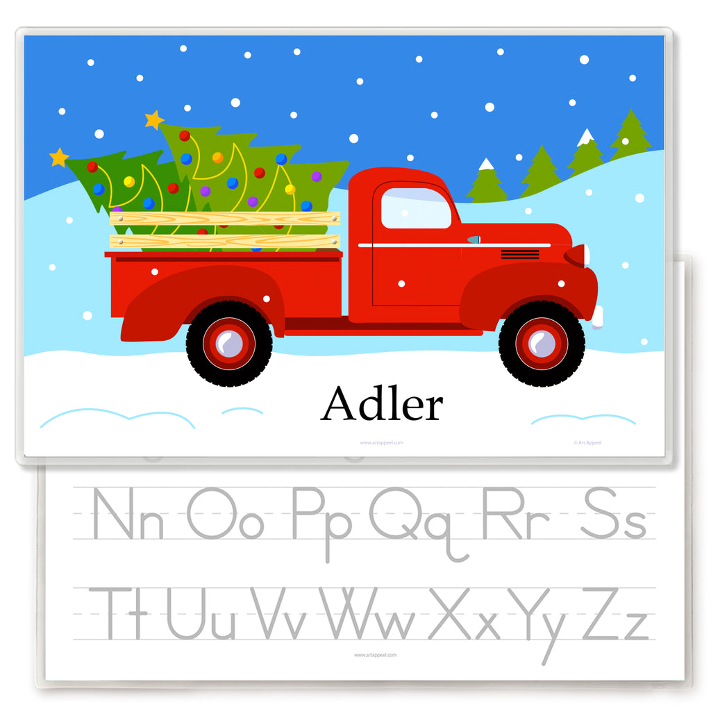 Christmas personalized placemat for kids with vintage red pickup truck, christmas trees and snow. Child's name is at the center bottom. Reverse side has alphabet letters for personalization.