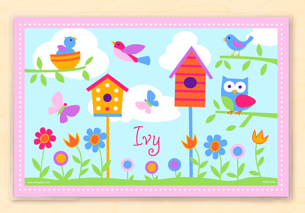 Personalized Kids Placemat with birds, birdhouses, bird nests and trees on a blue sky