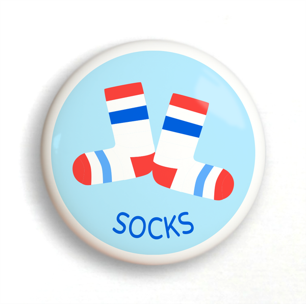 Ceramic drawer knob white socks with red and blue stripes on a light blue ground with the word socks written below