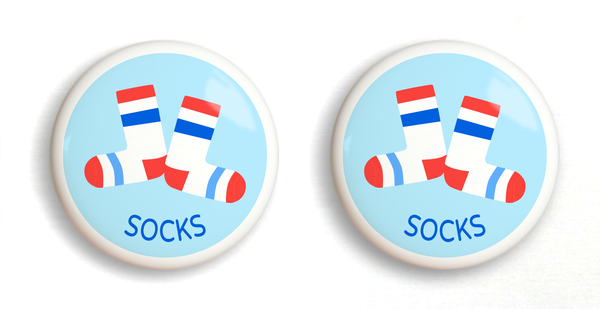 2 ceramic drawer knobs white socks with stripes on a light blue ground with the word socks written below