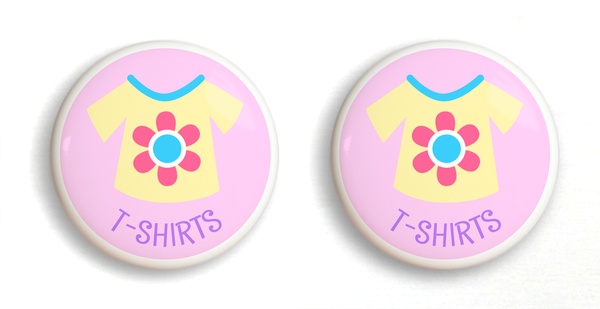 2 Ceramic drawer knobs, girls t-shirt on a pink ground with the word T-Shirts written below