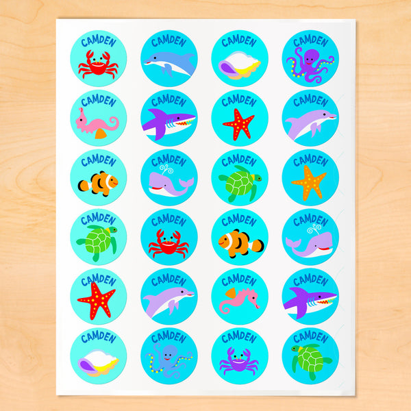 Personalized kids round lables with colorful sea creatures on blue-green backgrounds