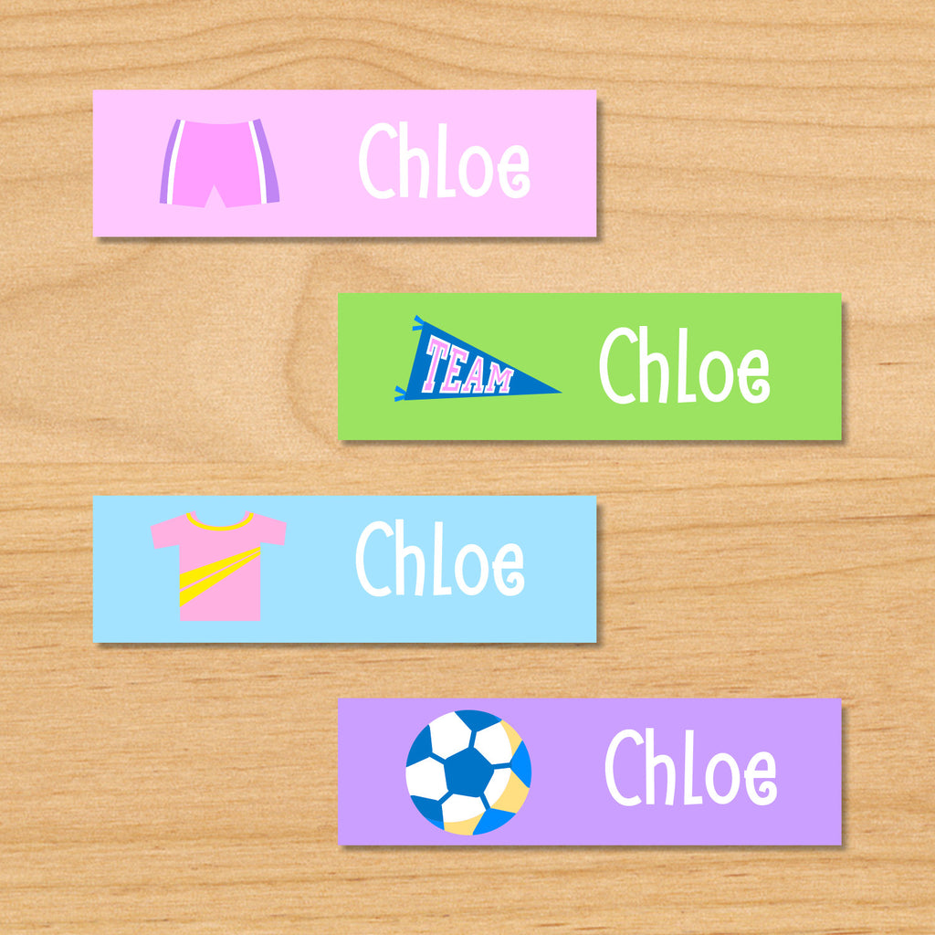 Soccer girls personalized kids mini waterproof labels with soccer shorts, pennant, soccer jersey, and soccer ball on pink, green, blue and purple backgrounds