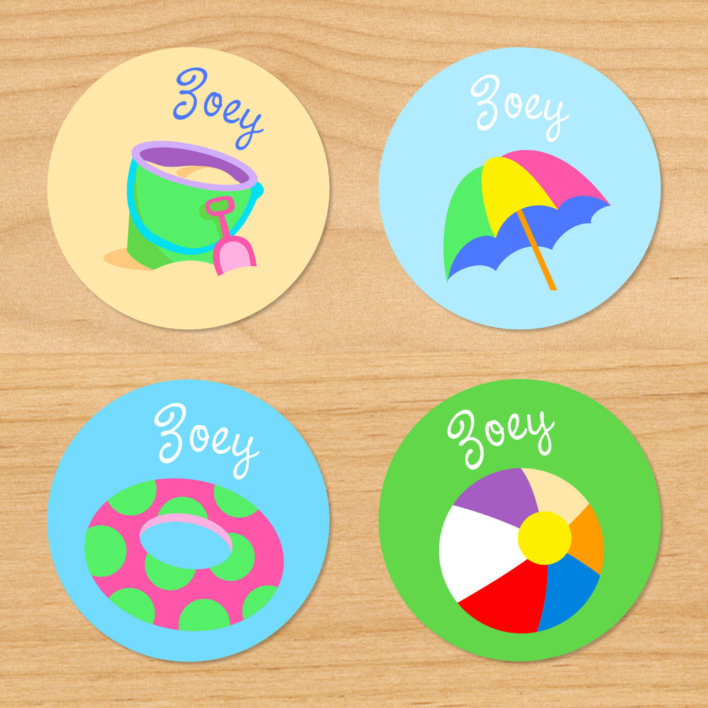 Summer beach personalized kids name round waterproof labels with pail, shovel, sand, float, umbrella and beachball on sand, green and blue ocean background