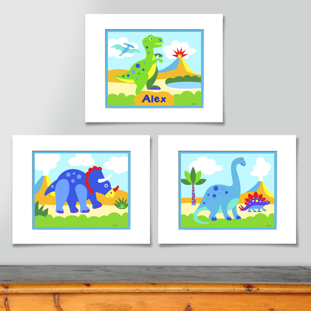 Set of 3 coordinating dinosaur prints. Personalized print features green T-rex in prehistoric landscape. Second features triceratops in landscape, third print features brontosaurus in landscape. Brightly colored with blues and greens.