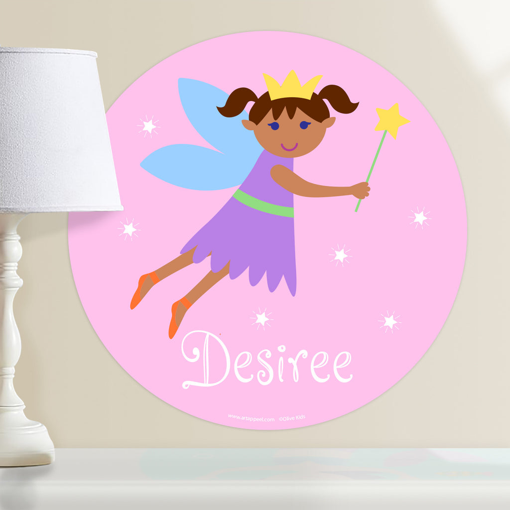 Kids fairy personalized circular wall decal. Dark complection fairy with straight hair on a pink packground.