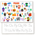 Image showing front and back of a personalized Halloween placemat for kids. The front features the alphabet with a Halloween icon for each letter. Back has alphabet letters for tracing.