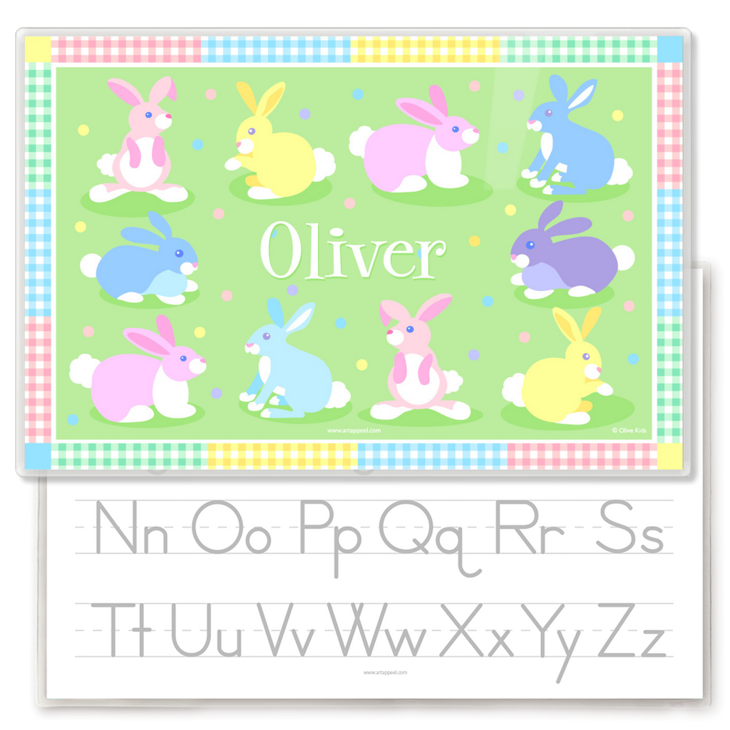 Personalized kids placemat with colorful pastel Easter bunnies on a green background, gingham patchwork border, and the name Oliver in the center.