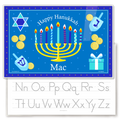 A personalized kids' placemat featuring a Hanukkah theme with a menorah, dreidels, and gelt, and a child's name.