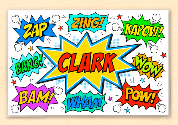 Personalized superhero placemat for kids featuring their name and phrases like pow and zoom in decorative fonts.