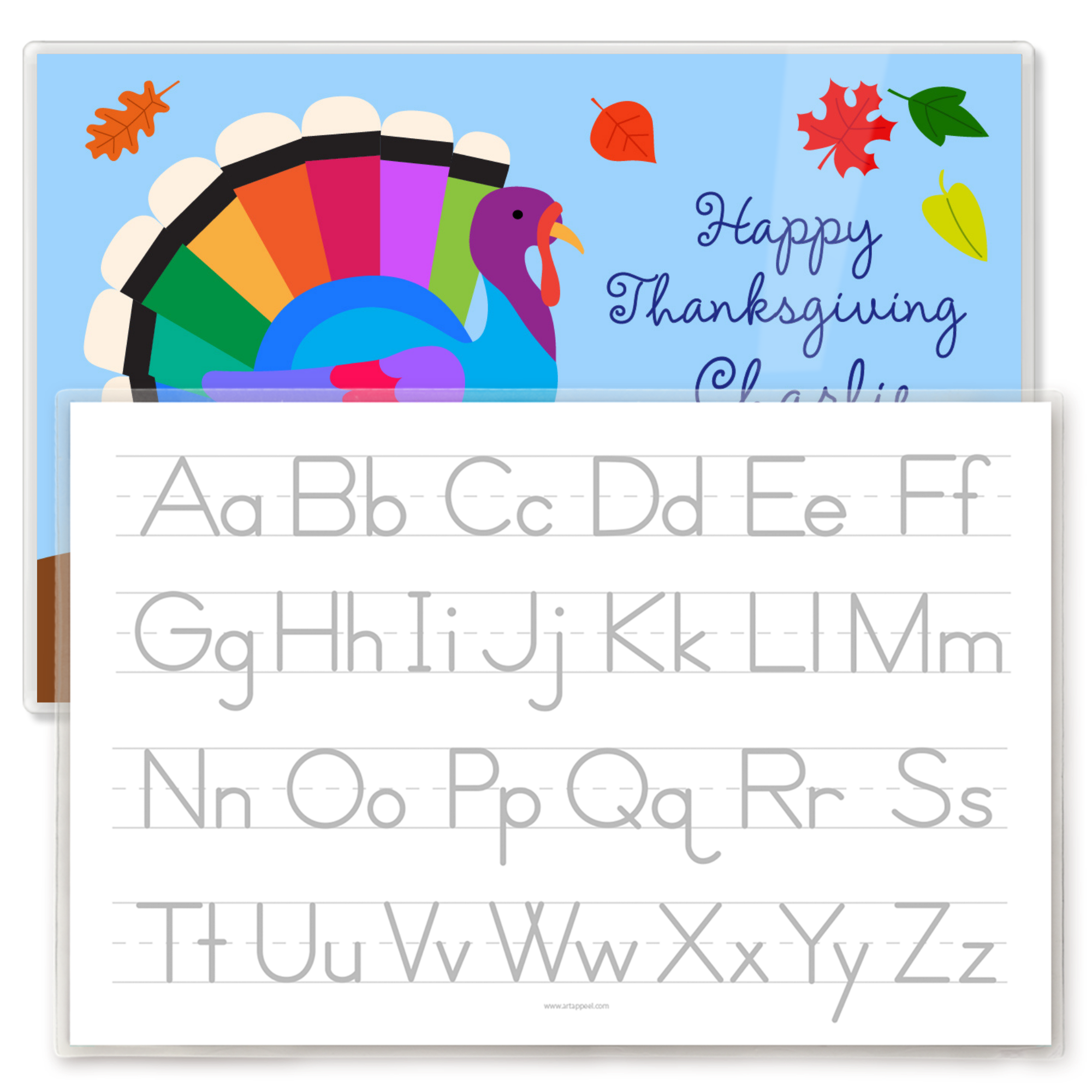 Colorful Thanksgiving-themed children's placemat with a rainbow turkey, pumpkins, falling leaves, and a bucket of apples, featuring the back side of the placemat with a traceable alphabet.