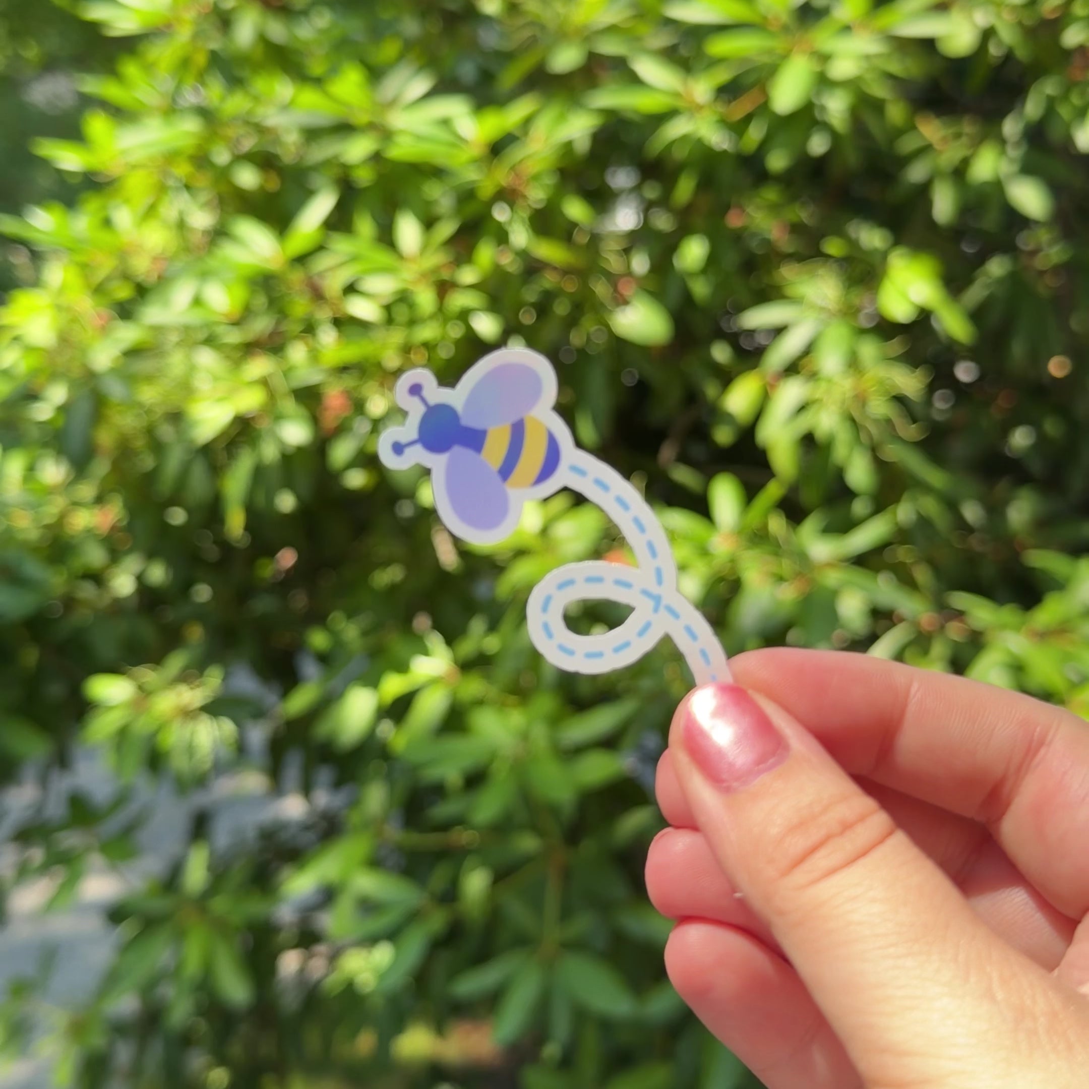 Kids holographic bumblebee sticker shimmering in the sunlight