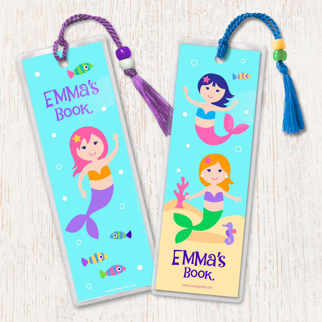 Kids personalized bookmarks with mermaids in an ocean scene, decorated with tassel and beads.