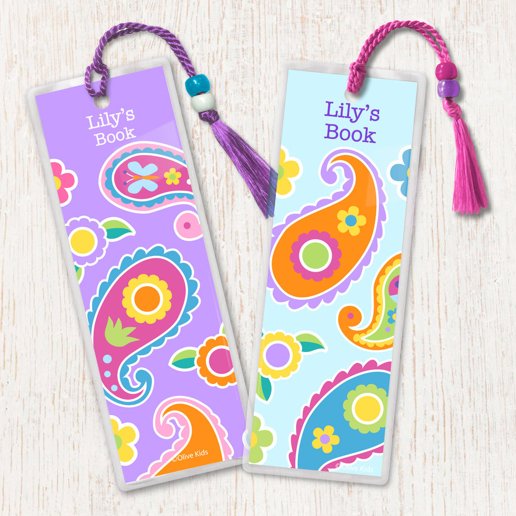 Kids personalized name bookmarks with colorful paisley design on soft colored background, decotrated with tassel and beads.