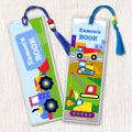 Construction themed kids personalized name bookmarks. Brightly colored trucks on a construction site background, decorated with tassesl and beads.