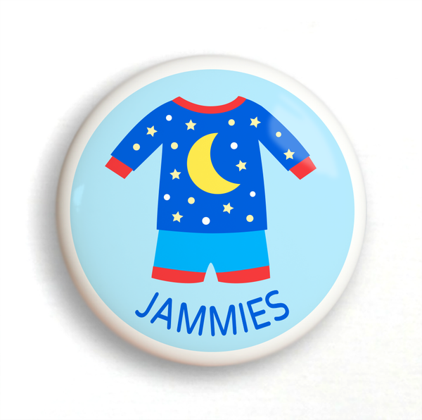 Ceramic drawer knob, blue pajamas with yellow moon and stars on a light blue ground with the word jammies written below