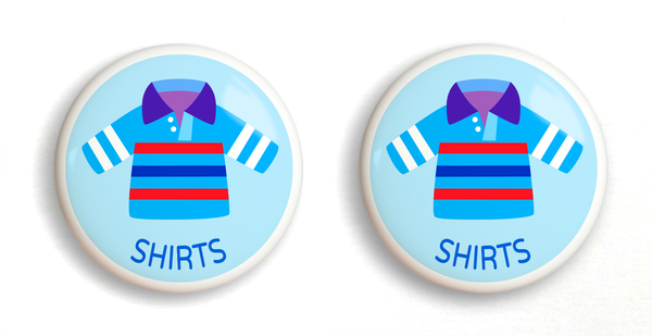2 Ceramic drawer knobs with boy's shirts on a light blue ground with the word Shirts written below