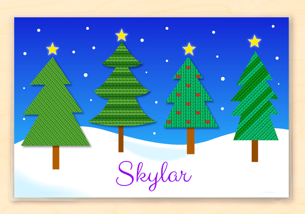 Christmas Pine Trees personalized placemat for kids. Four pine trees with sweater knit patterns on a snowy scene. Personalized with name at the bottom.