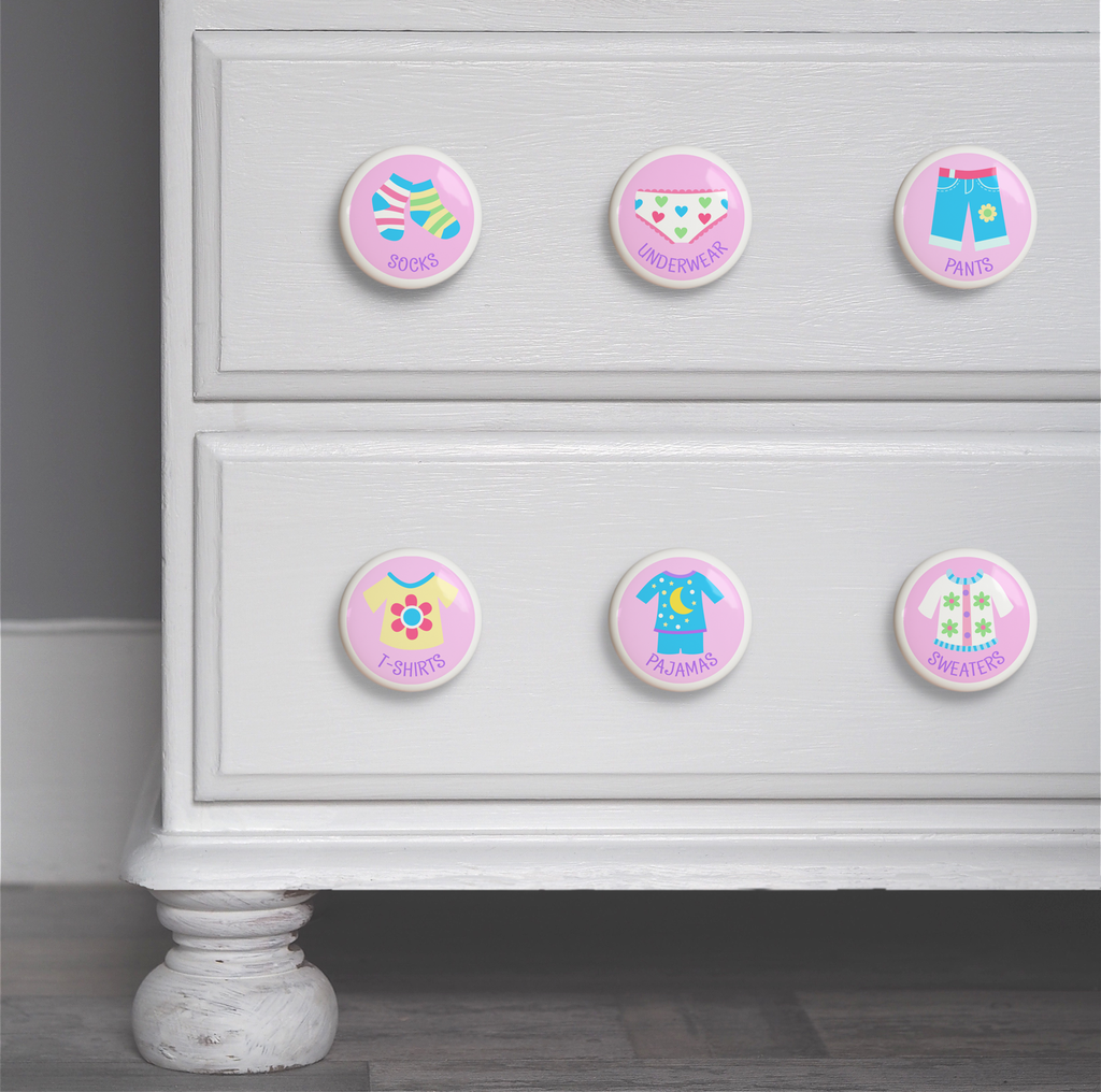Girls ceramic drawer knob on a dresser set of 6, one each of socks, underwear, pajamas, sweaters, t-shirts, and pants