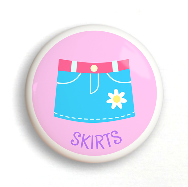 Ceramic drawer knob with Girl's Skirt on a pink background with the word Skirts written below