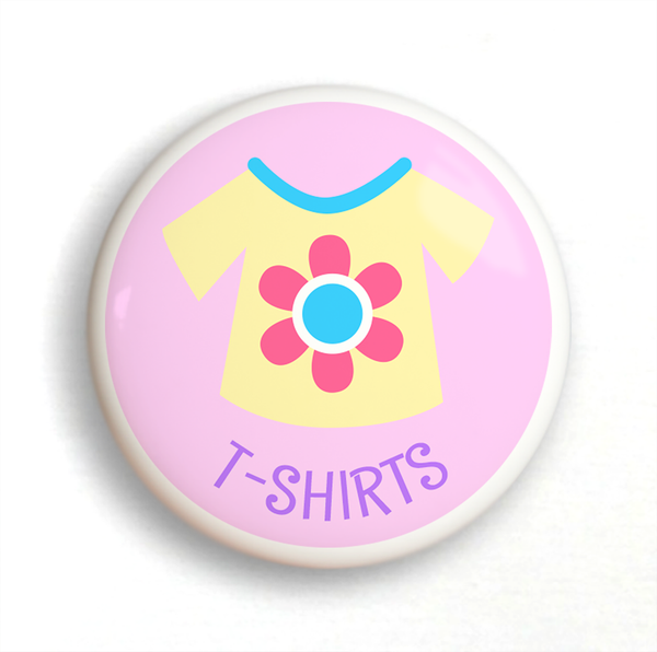 Ceramic drawer knob with a yellow girl's t-shirt on a pink background with the word T-Shirts written below