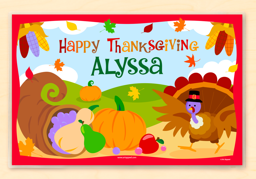 Thanksgiving placemat features a Turkey, a horn of plenty with autum vegetables, in an autumn scene.  Personalized with child's name.
