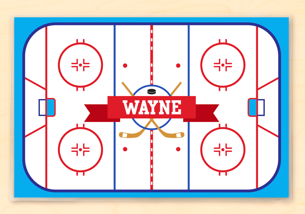 Hockey Rink personalized children's sports placemat with a top-down view of a hockey rink and child's name in white varsity letters on a red ribbon