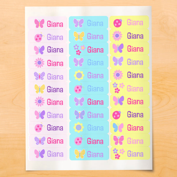 Personalized kids lables with butterflies, flowers and ladybugs on soft color backgrounds