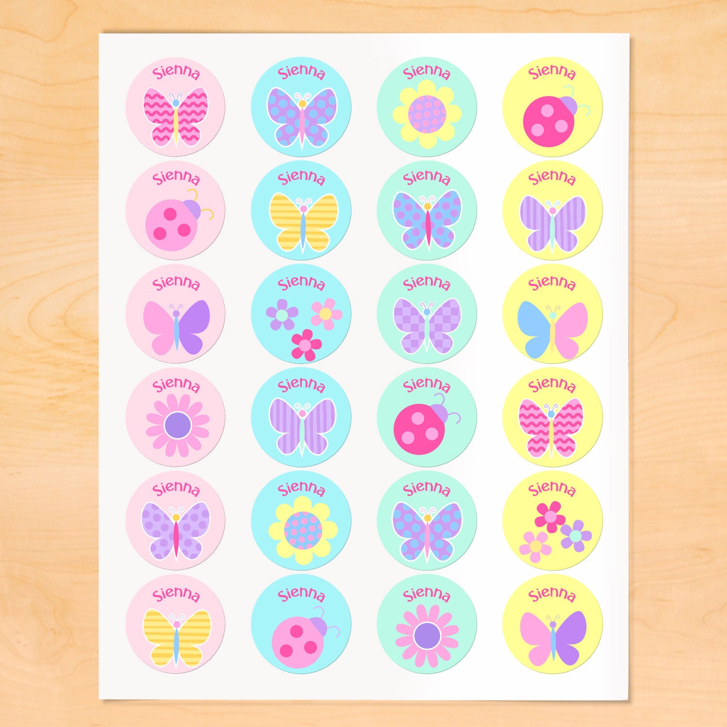 Personalized kids round lables with butterflies, flowers and ladybugs on soft color backgrounds