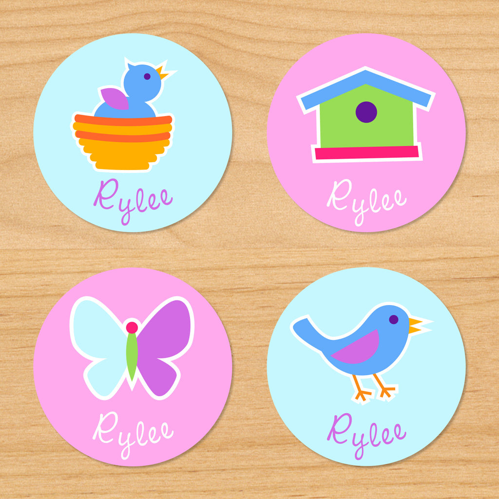 Birdie personalized kids round waterproof name labels with bird in nest, birdhouse, bluebird and butterfly on blue and pink backgrounds
