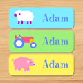 Country baby kids waterproof name labels with farm animals featuring a sheep, pig and tractor in pastel colors and a spring theme