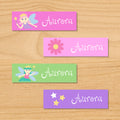Fairy princess personalized kids mini waterproof name labels with pastel fairies, flowers, and gold stars on pink, purple and green backgrounds