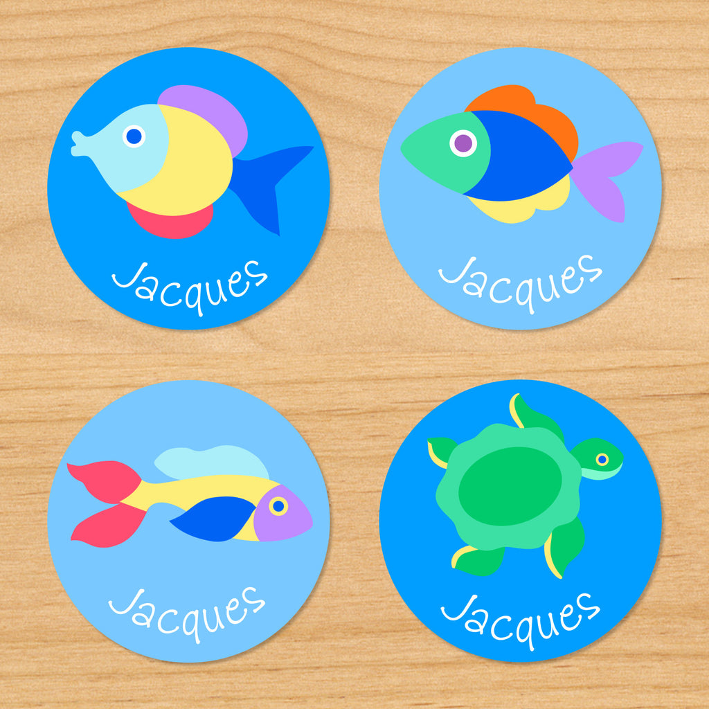 Somethin' fishy personalized ocean kids round waterproof labels with name and colorful fish on blue ocean water tropical background