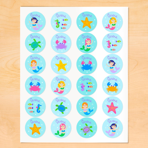 Personalized kids round lables with mermaids, starfish and sea creatures on soft blue backgrounds