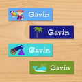 Pirates personalized kids name mini waterproof labels with little pirate, palm tree, cannon, and whale on blue and green ocean beach background