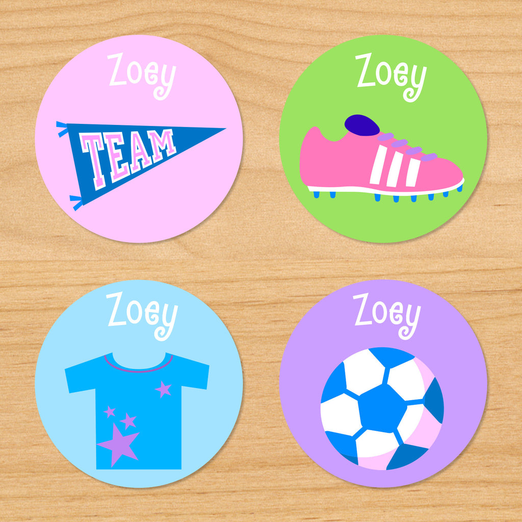 Soccer girls personalized kids round waterproof labels with soccer shorts, pennant, soccer cleats, and soccer ball on pink, green, blue and purple backgrounds