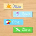 Summer beach personalized kids name mini waterproof labels with starfish, beachchair, beachball and seagull on sand, green and blue ocean background