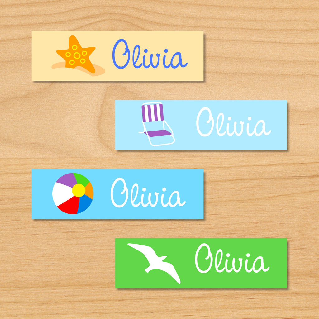 Summer beach personalized kids name mini waterproof labels with starfish, beachchair, beachball and seagull on sand, green and blue ocean background