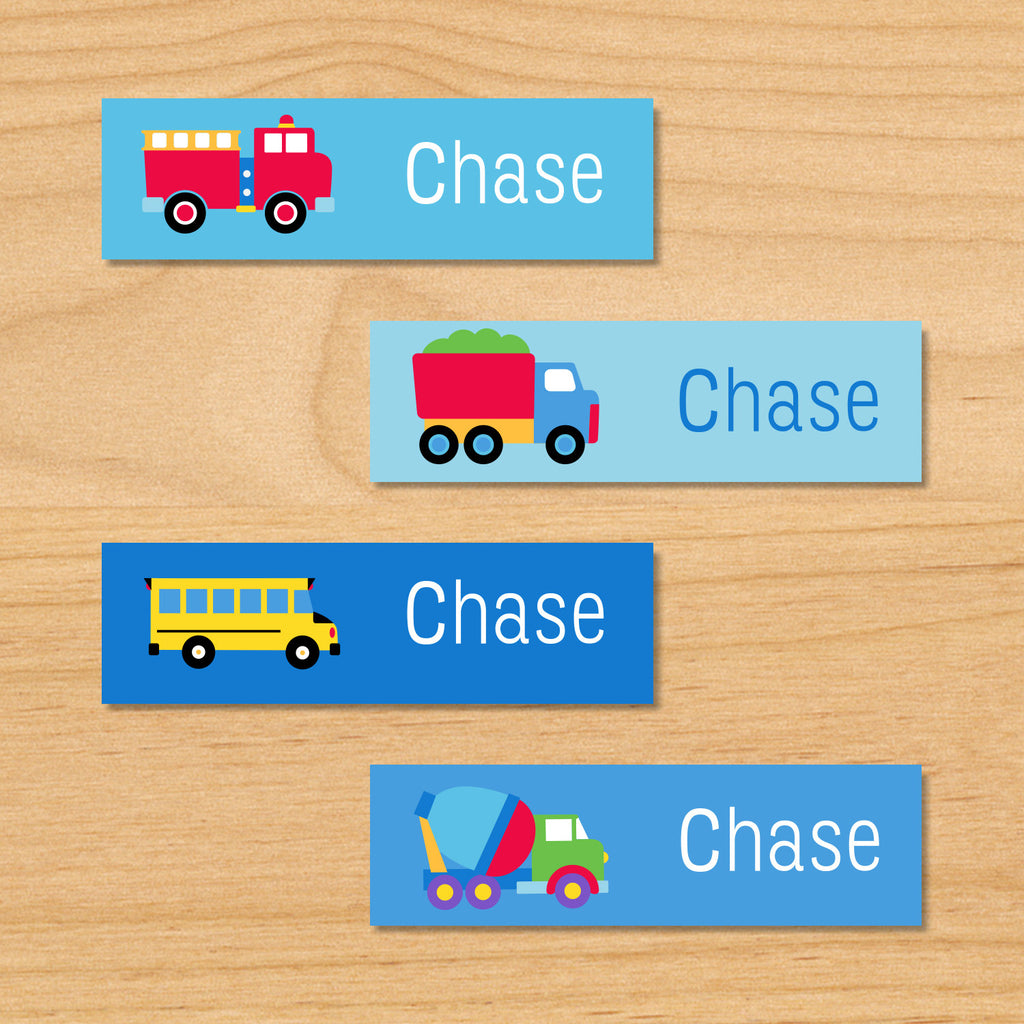 Trains, planes and trucks personalized kids mini waterproof name labels with firetruck, dumptruck, schoolbus, and cement truck on a blue background