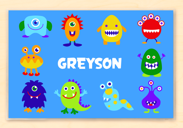 Personalized Kids Monster Placemat with happy, colorful, little monsters on a blue backgroun
