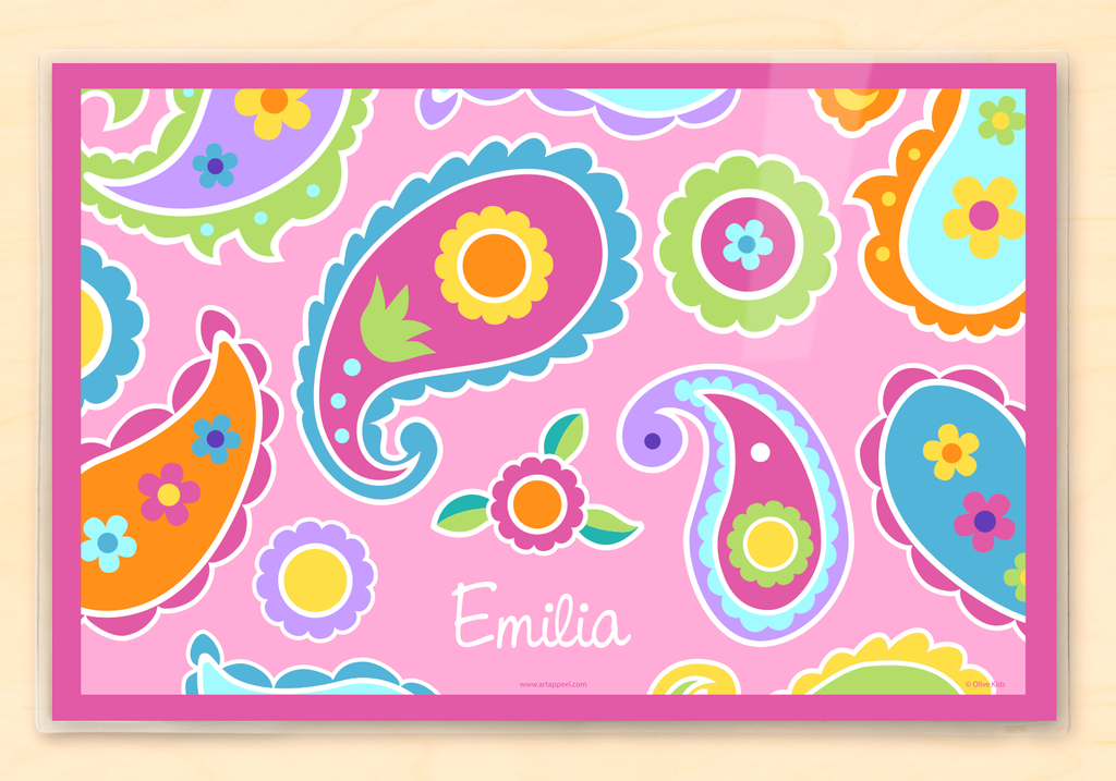 Personalized Kids Placemat with a pink paisley design with colorful flowers and paisleys on a pink background