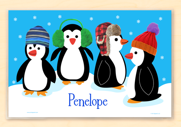 Holiday penguins kids personalized name placemat with knitted winter hats and snow.