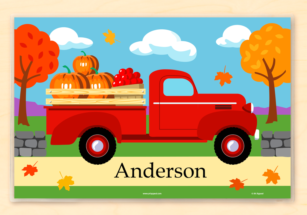 Fall pickup truck personalized kids placemat with red truck, colorful leaves, pumpkins, and stonewall