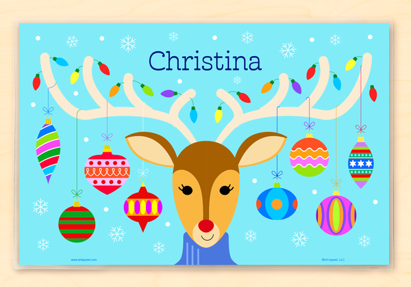 Personalized Christmas place mat with a portrait of a reindeer in a turtle neck sweater, with Christmas ornaments and Christmas lights on  antlers. Name is at the top. 