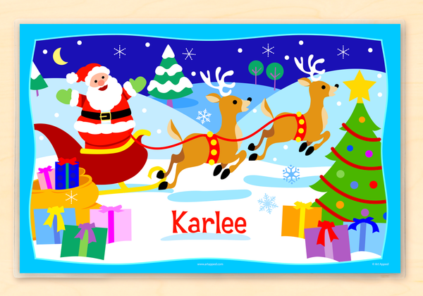 Christmas Santa Sleigh Personalized Kids Placemat. Santa and his reindeer in a snowy Christmas scene with child name personalized at the bottom in red.
