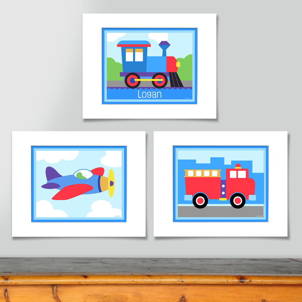 Transportaion prints include, colorful train engine personalized with childs name, airpalne in sky with clouds, and red fire engine in front of a simple city skyline.