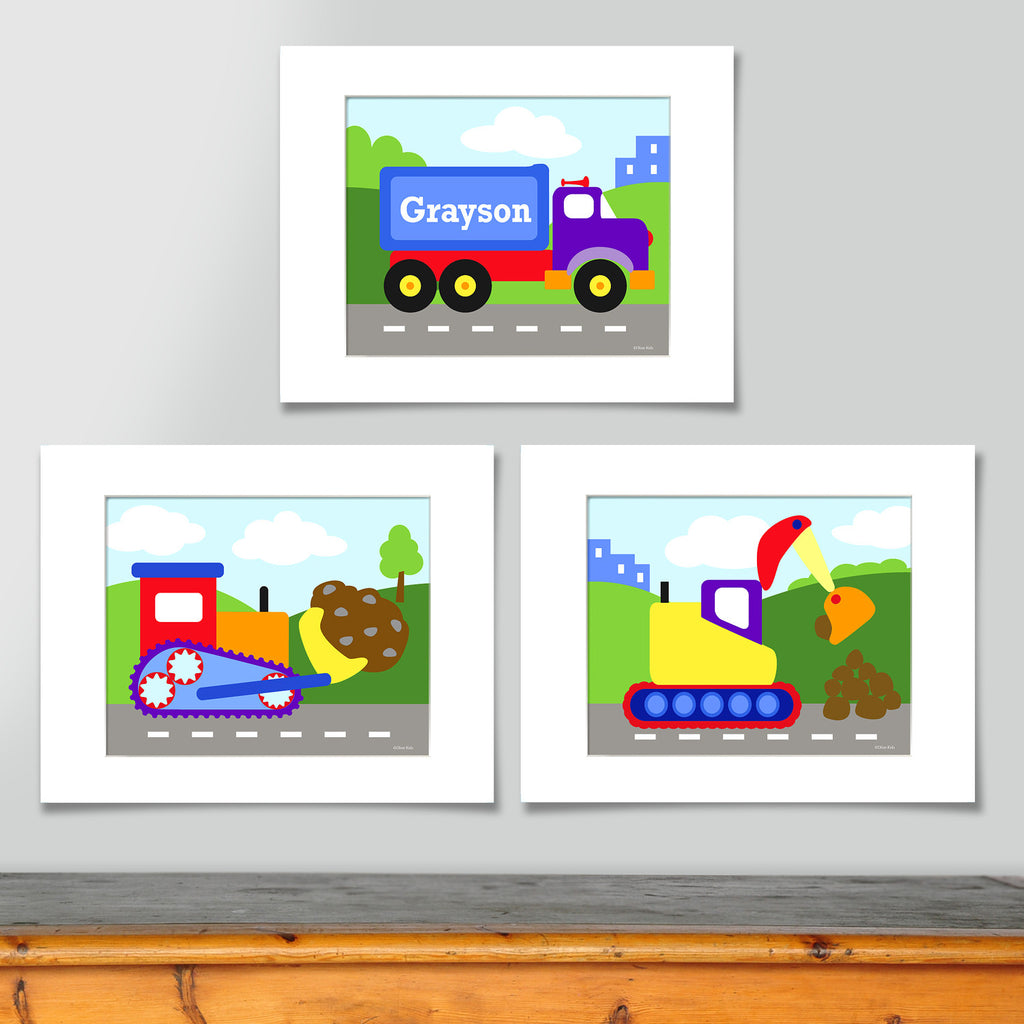 Colorful construction themed personalized art print set . Prints include a personalized tractor trailer truck, a colorful bulldozer and a digger, all on construction site backgrounds. 