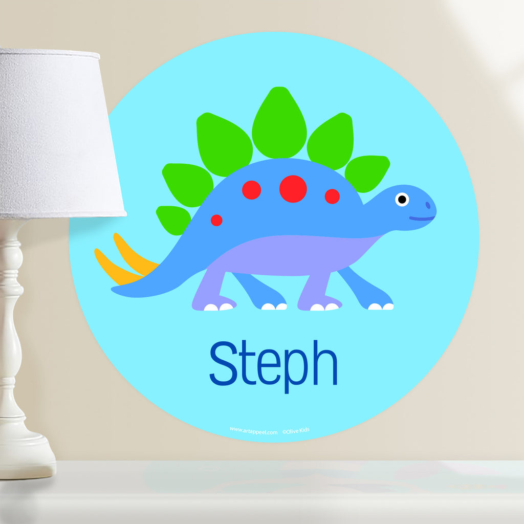 Kids personalized circular wall decal.Blue, green and purple dinosaur on light blue background.