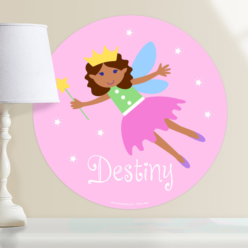 Kids fairy personalized circular wall decal. Dark complection fairy with curly hair on a pink packground.